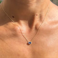 Tanzanite and Diamond Halo Pendant Necklace