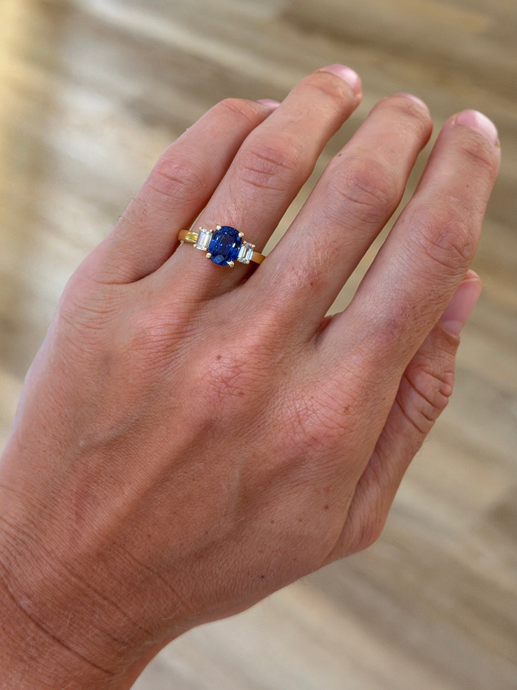 Sapphire Ring with Emerald Cut Diamond Accents
