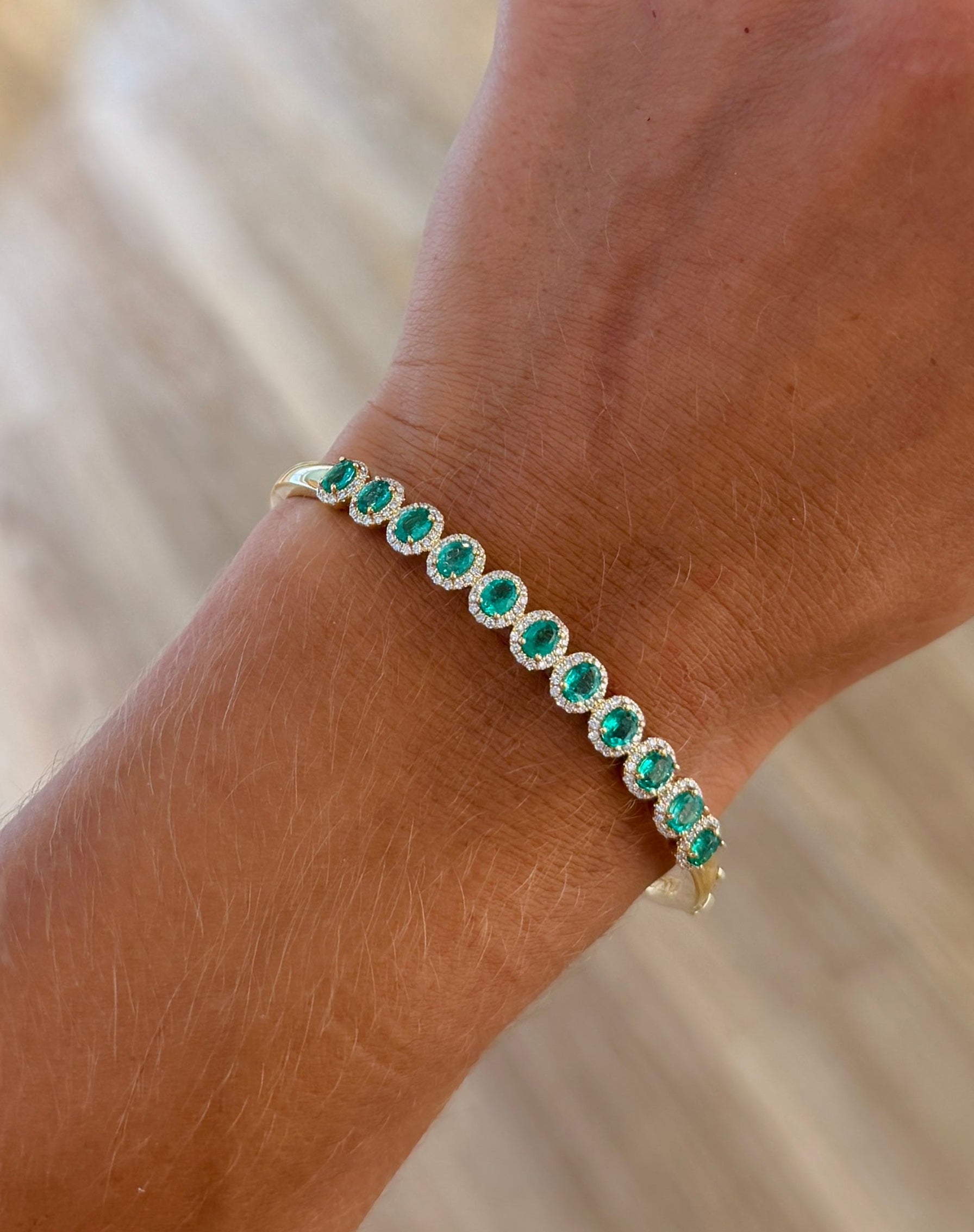Oval Emeralds & Diamond Halo Bangle