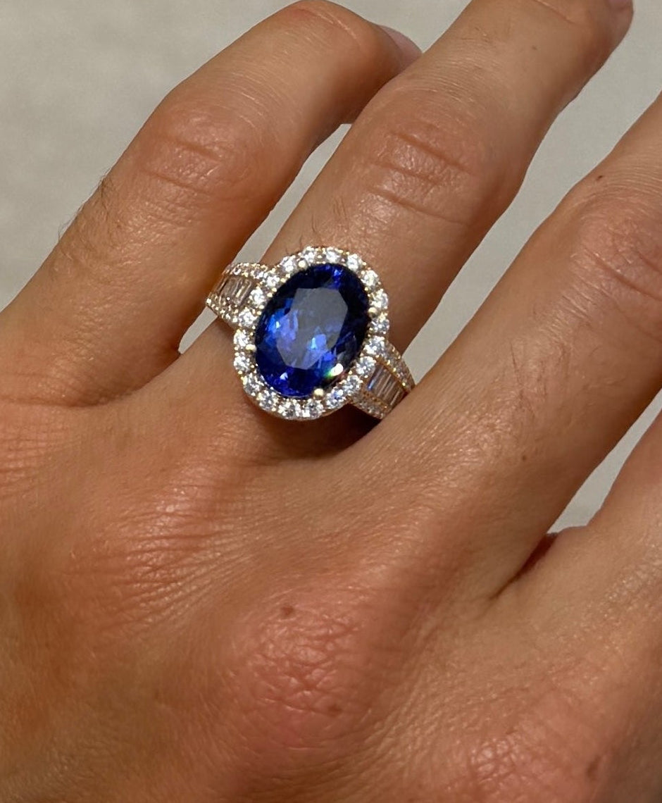 Tanzanite Oval Cocktail Ring with Diamond Halo and Half Eternity Band