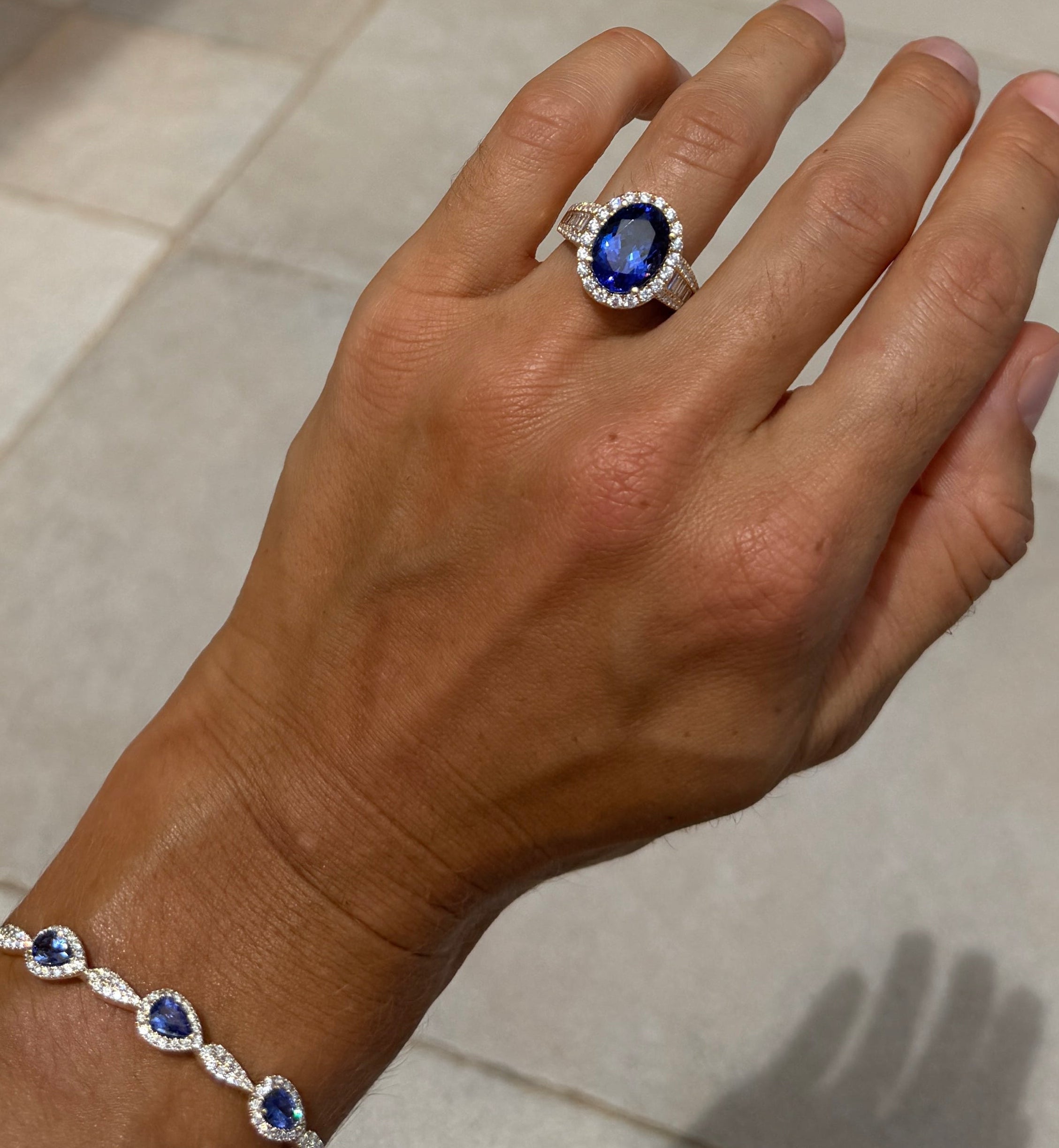 Tanzanite Oval Cocktail Ring with Diamond Halo and Half Eternity Band