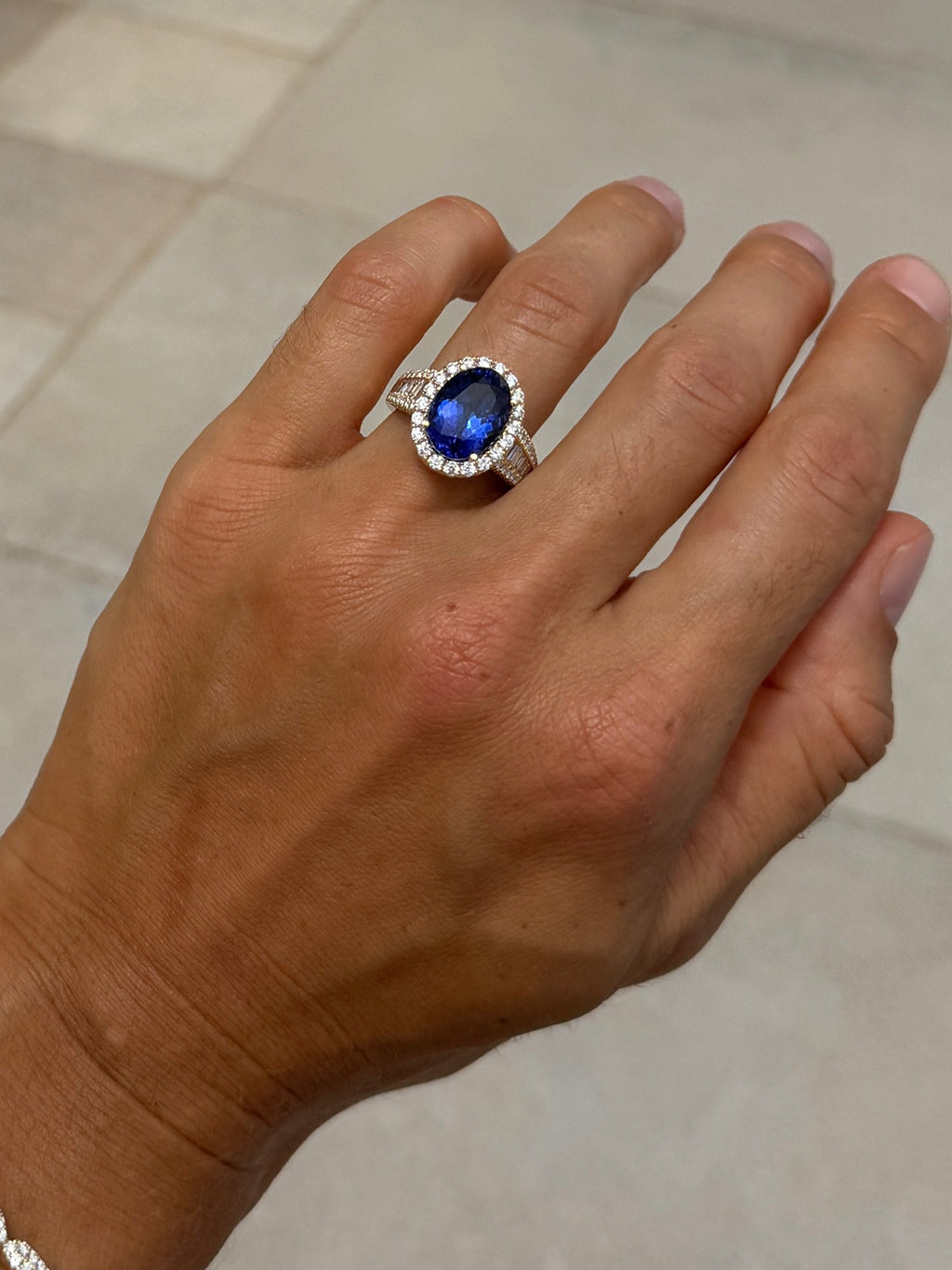 Tanzanite Oval Cocktail Ring with Diamond Halo and Half Eternity Band