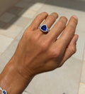 Tanzanite Trillion Cut Cocktail Ring with Diamond Halo and Band