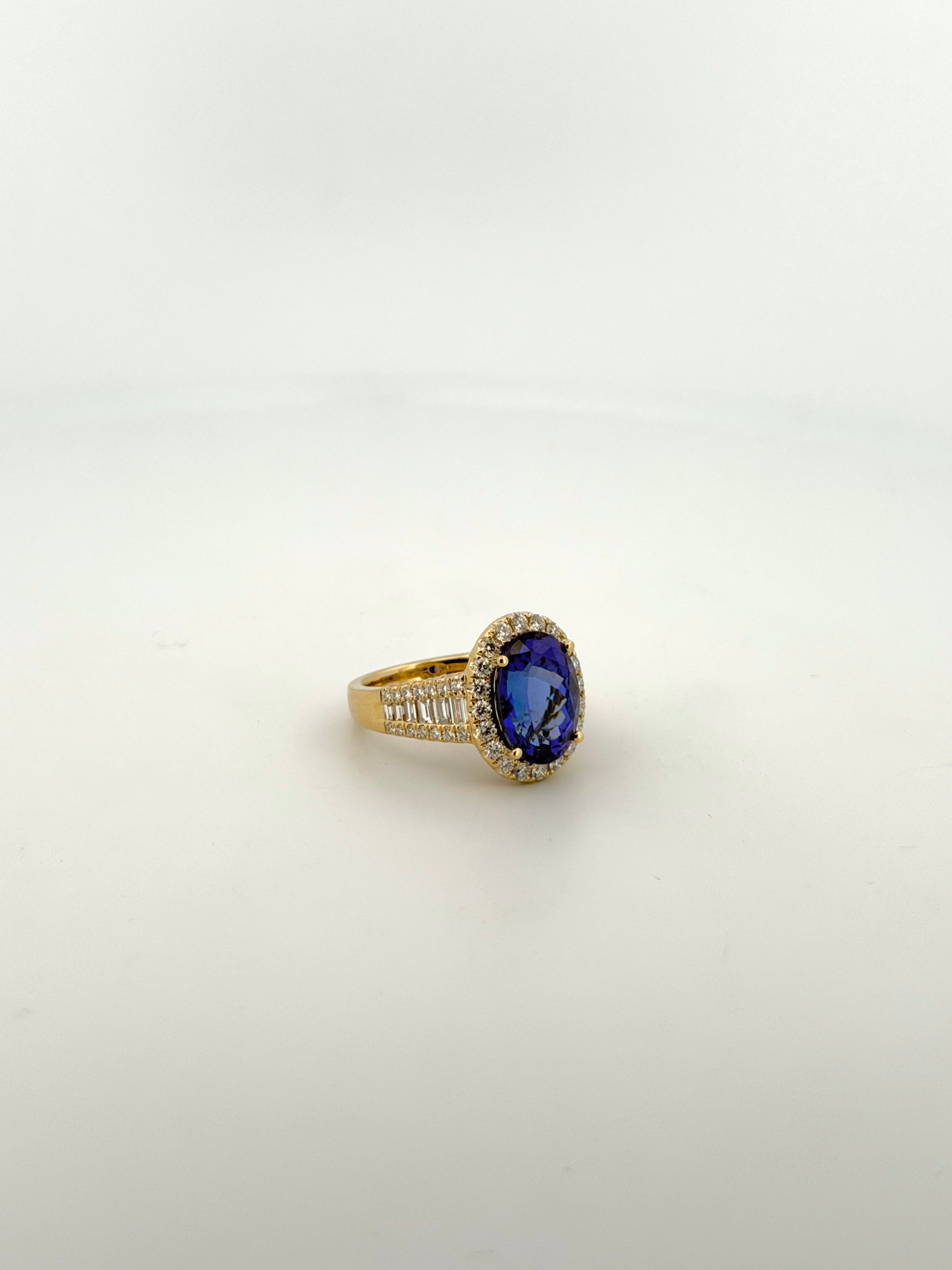 Tanzanite Oval Cocktail Ring with Diamond Halo and Half Eternity Band