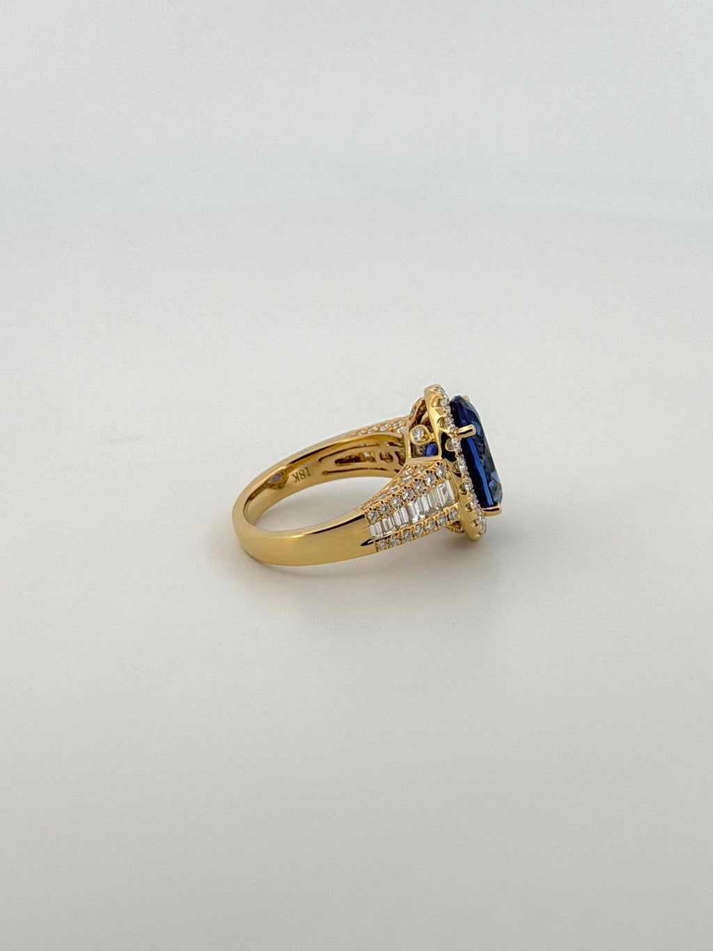 Tanzanite Oval Cocktail Ring with Diamond Halo and Half Eternity Band