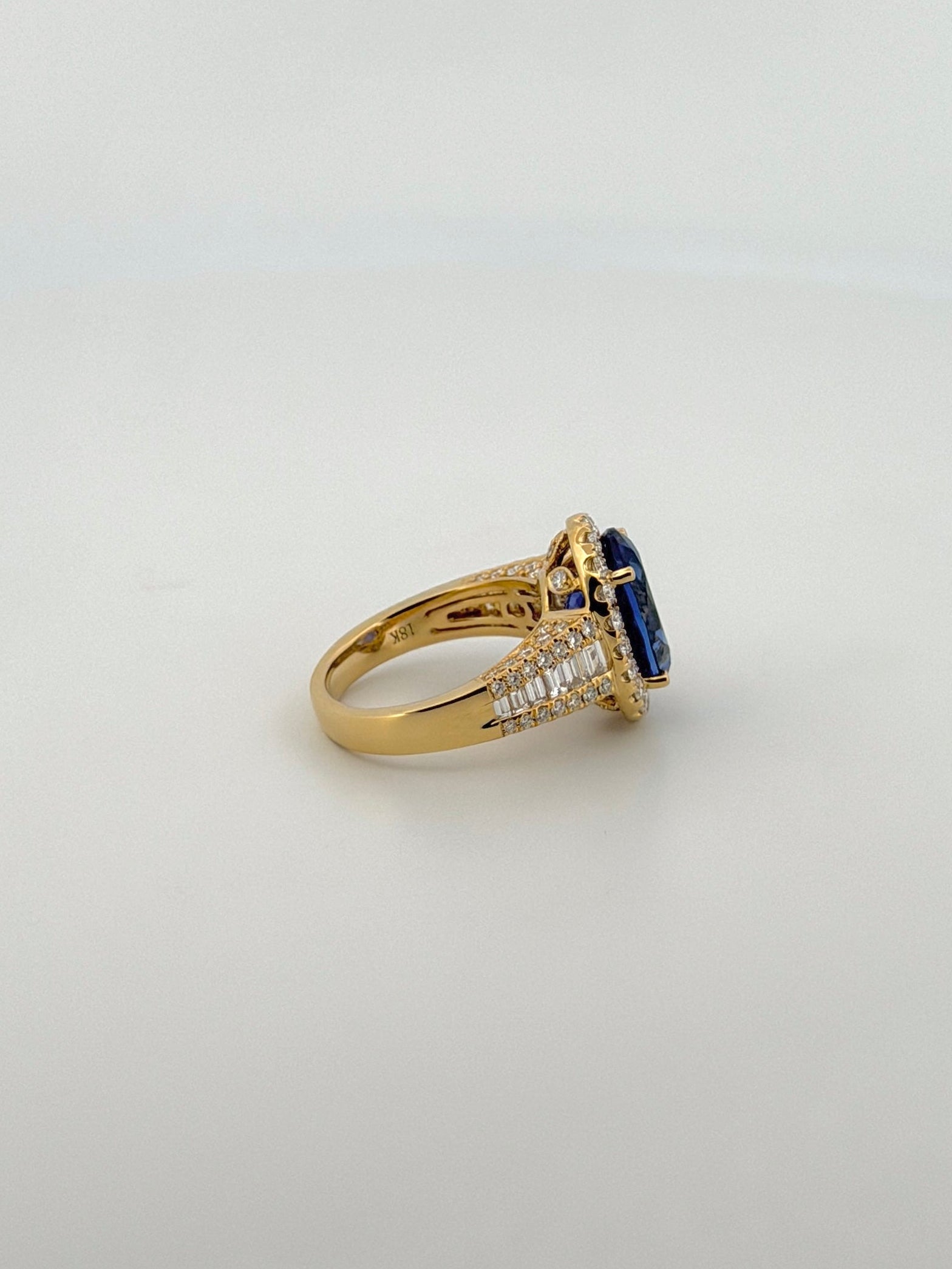 Tanzanite Oval Cocktail Ring with Diamond Halo and Half Eternity Band