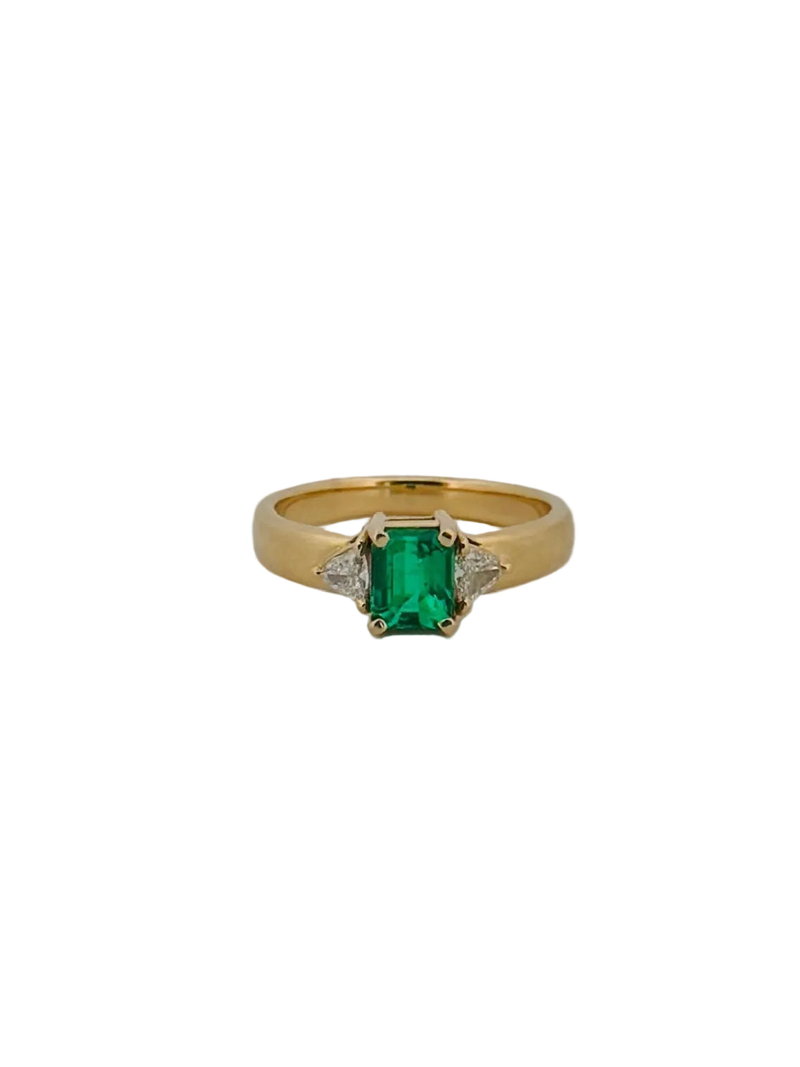 Emerald Flanked By Trillion Diamonds Ring