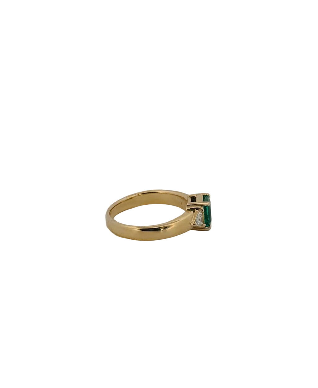 Emerald Flanked By Trillion Diamonds Ring