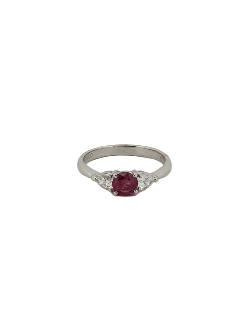 Round ruby ring flanked with diamonds