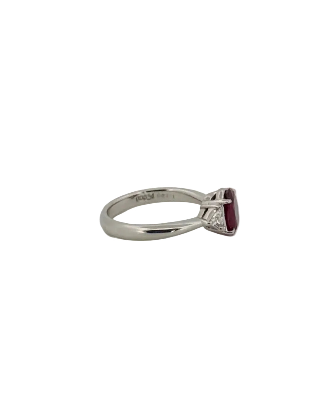 Oval ruby ring flanked with diamonds