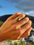Emerald Flanked By Trillion Diamonds Ring