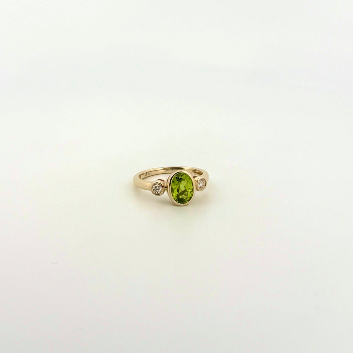 Oval Peridot and Diamond Bezel Ring