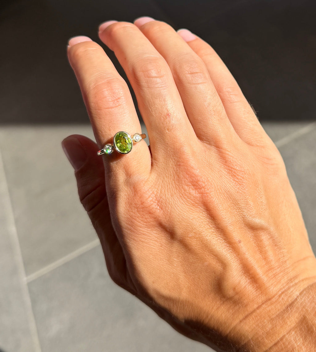 Oval Peridot and Diamond Bezel Ring