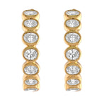 Round cut natural diamond earrings, bezel set, 14kt yellow gold.