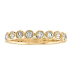 Round cut natural diamonds bezel set in 14kt yellow gold