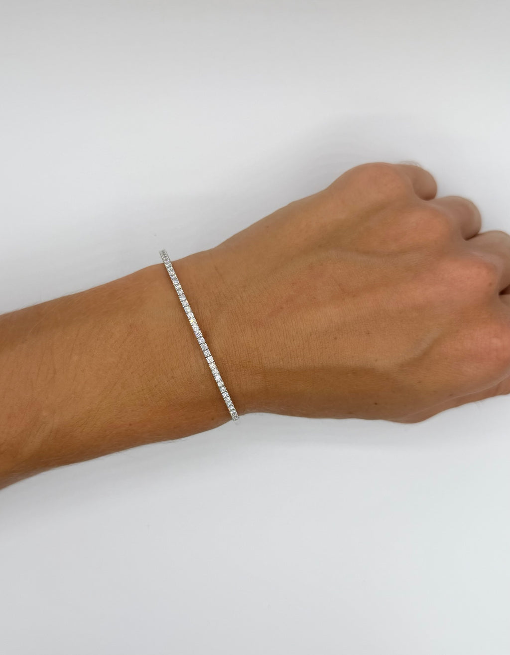 14K White Gold Diamond flexi bangle modeled on woman's hand