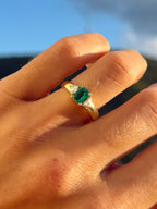 Emerald Flanked By Trillion Diamonds Ring