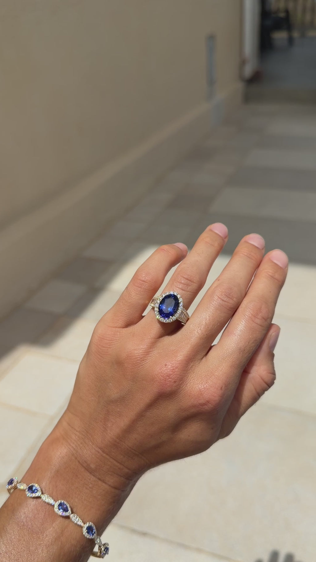 Tanzanite Oval Cocktail Ring with Diamond Halo and Half Eternity Band